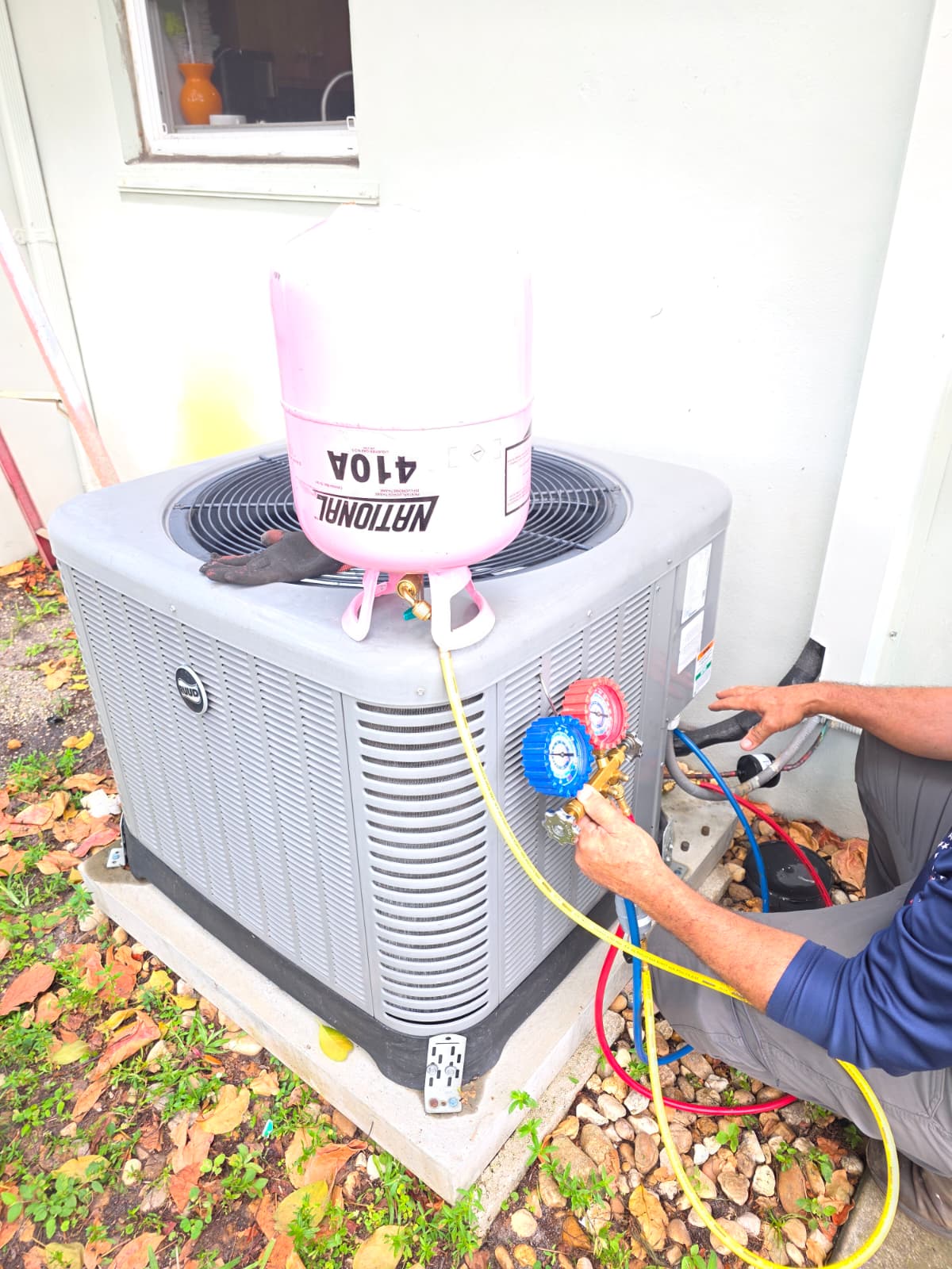 Refrigerant R-410A recharge service on residential AC unit
