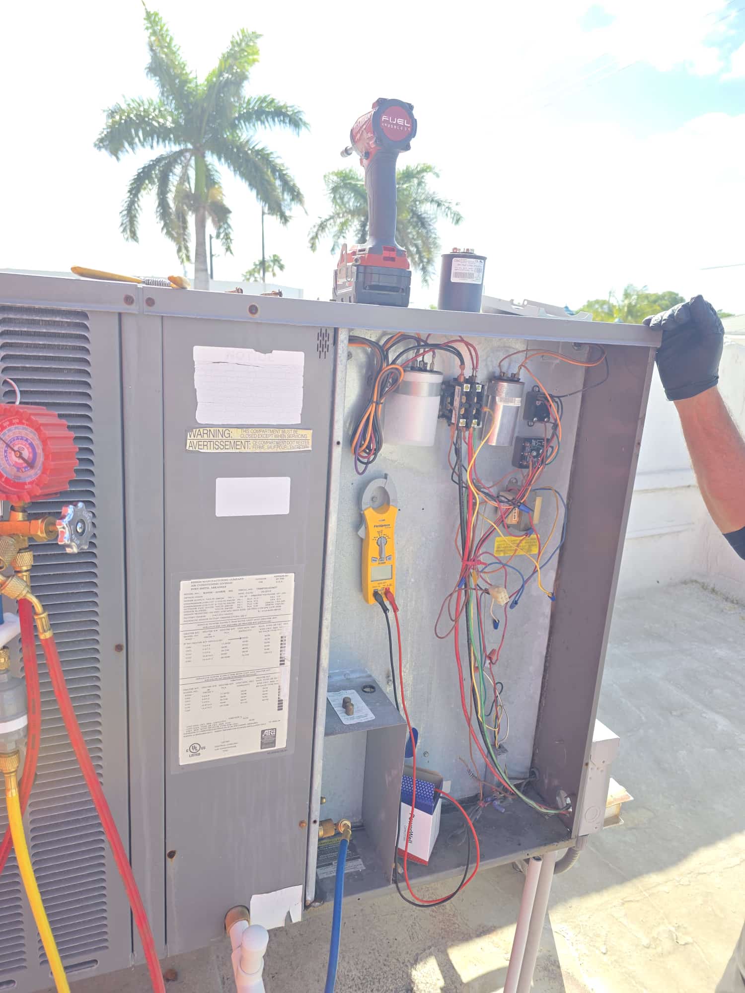 Mr. Martin technician performing detailed AC electrical repair